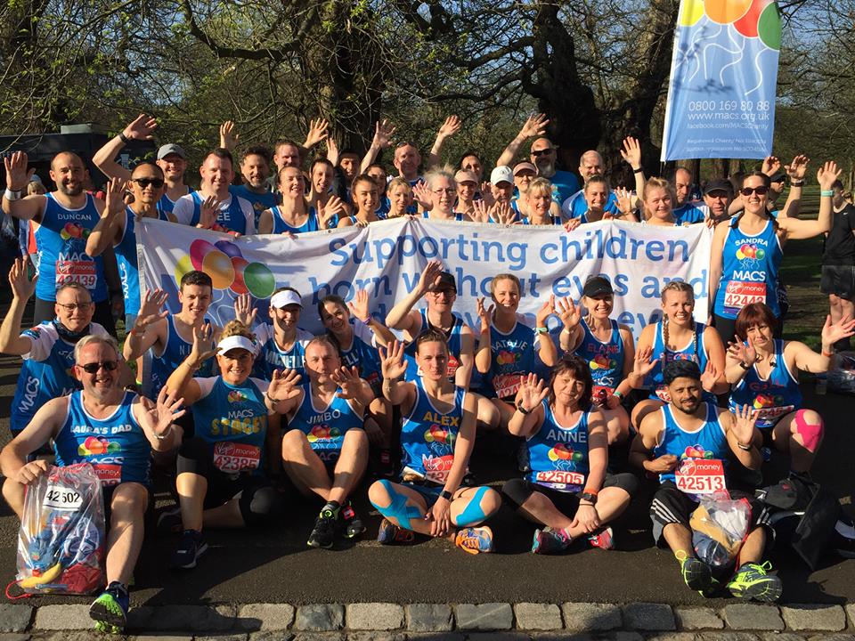 Image shows a group of London Marathon runners holding the MACS banner
