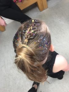 Image shows glitter hairstyle