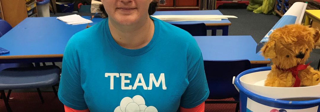 Image shows a smiling lady wearing a MACS t-shirt
